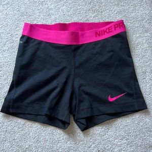 Black Nike Pros with a Pink Band